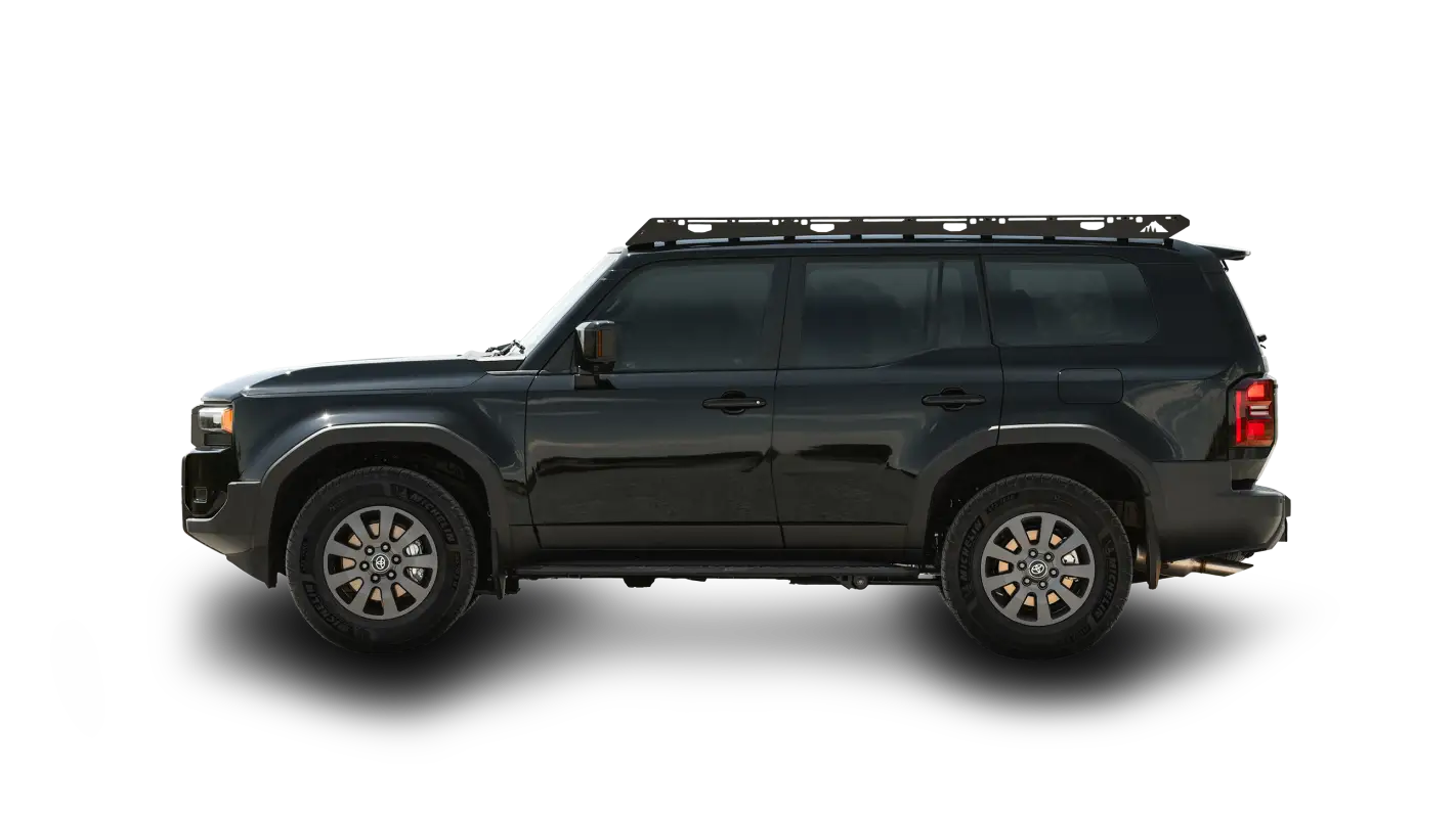 Side view of a black 2024 Toyota Land Cruiser equipped with The Atlas full-length roof rack, designed for durability and seamless installation.