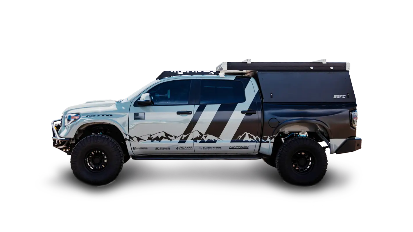 Toyota Tundra with Bear Paw Roof Rack and camper setup, featuring 6 crossbars and pressure mounts for optimized cargo storage.