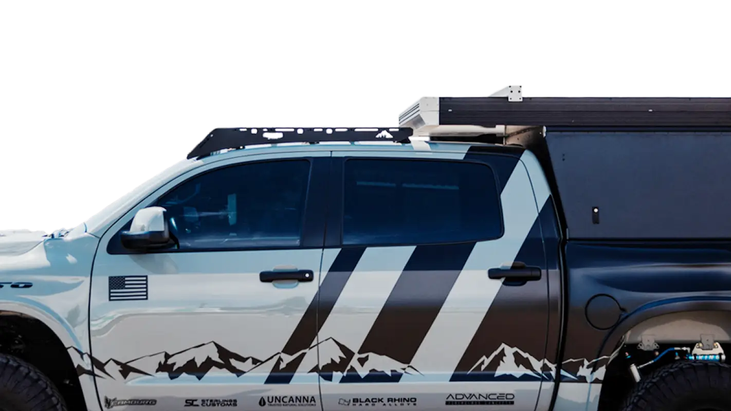 Close-up of Bear Paw Roof Rack installed on a Toyota Tundra, showcasing durable design and compatibility with camper setups.