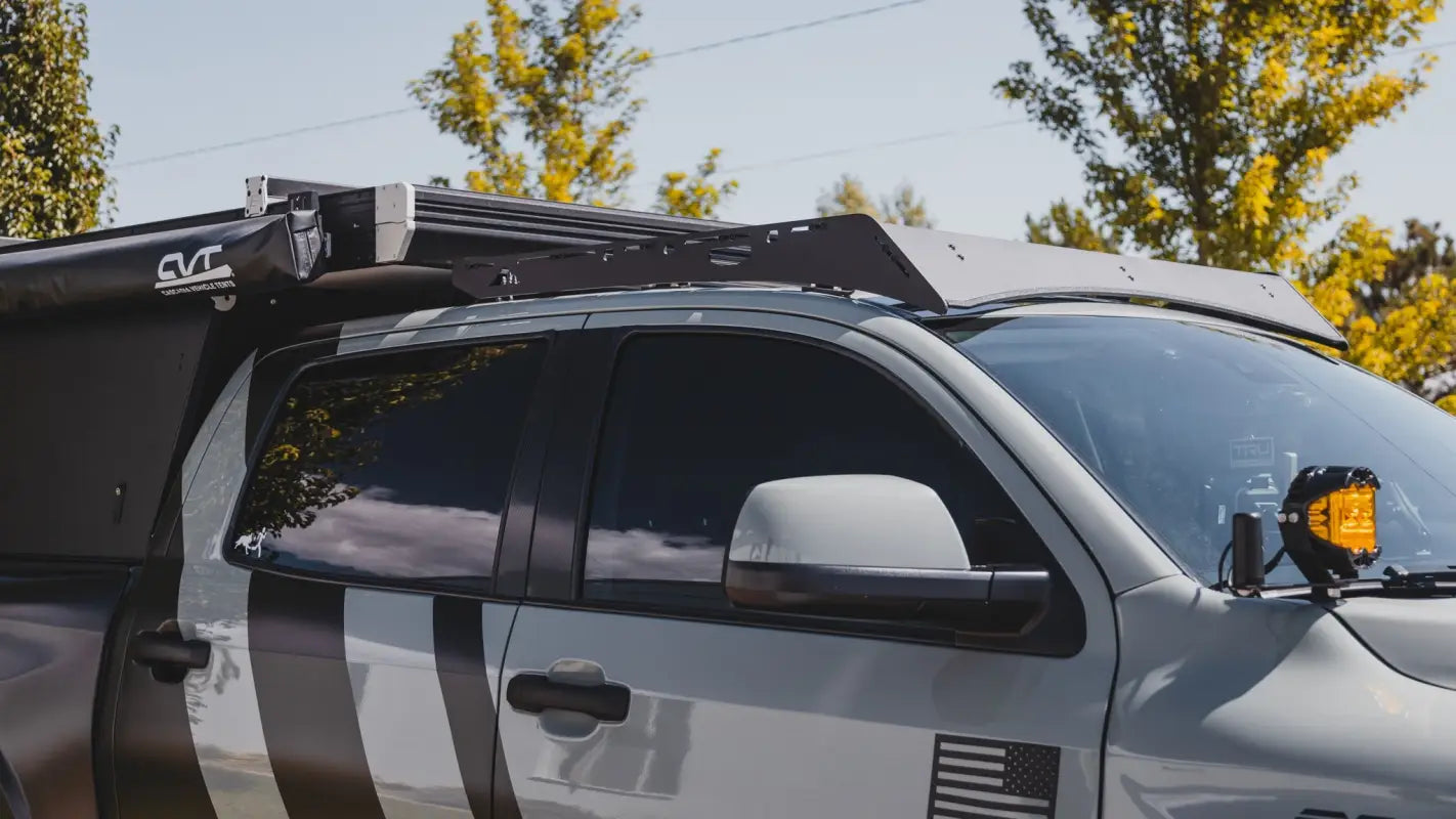 Side angle of Bear Paw Roof Rack on Toyota Tundra, paired with a camper setup for outdoor and overlanding use.