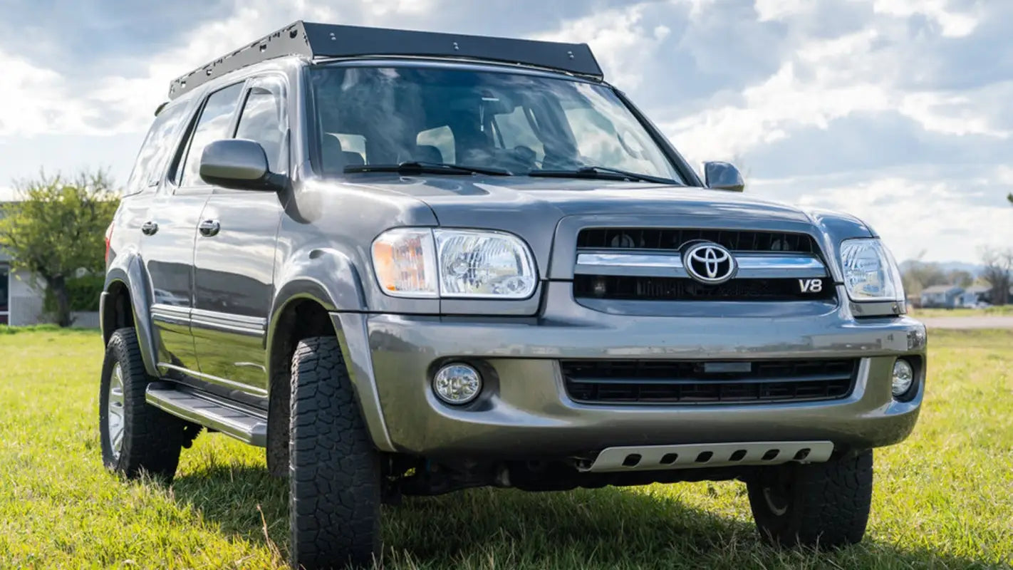 Front view of a silver 2001-2007 Toyota Sequoia with the Belford roof rack installed, perfect for carrying adventure gear with style.