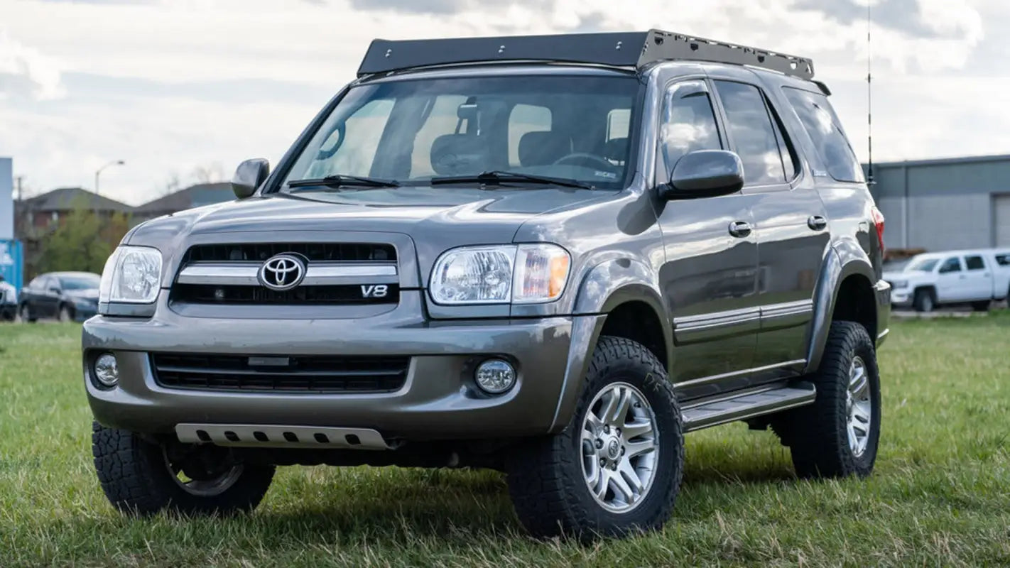 Angled front view of a 2001-2007 Toyota Sequoia featuring the Belford roof rack, ideal for outdoor enthusiasts needing extra cargo space.