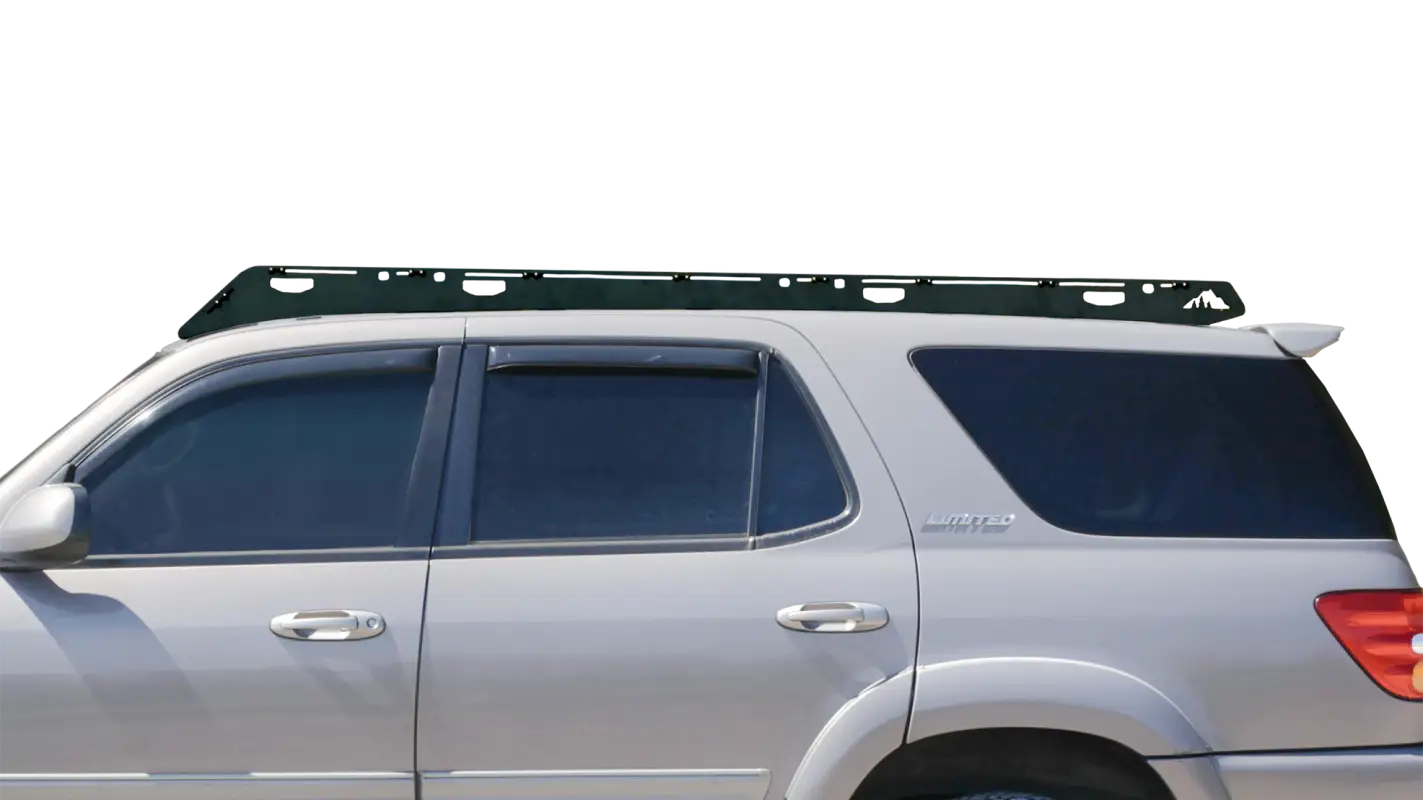 Close-up side view of the Belford roof rack installed on a 2001-2007 Toyota Sequoia, showcasing its durable black aluminum design.