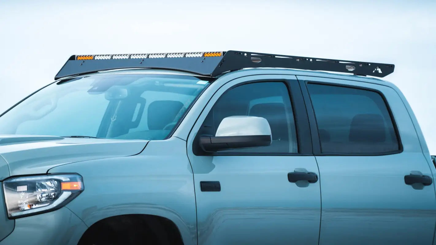 Close-up of Big Bear Roof Rack on Toyota Tundra CrewMax, showing precision aluminum construction and secure mounting system.