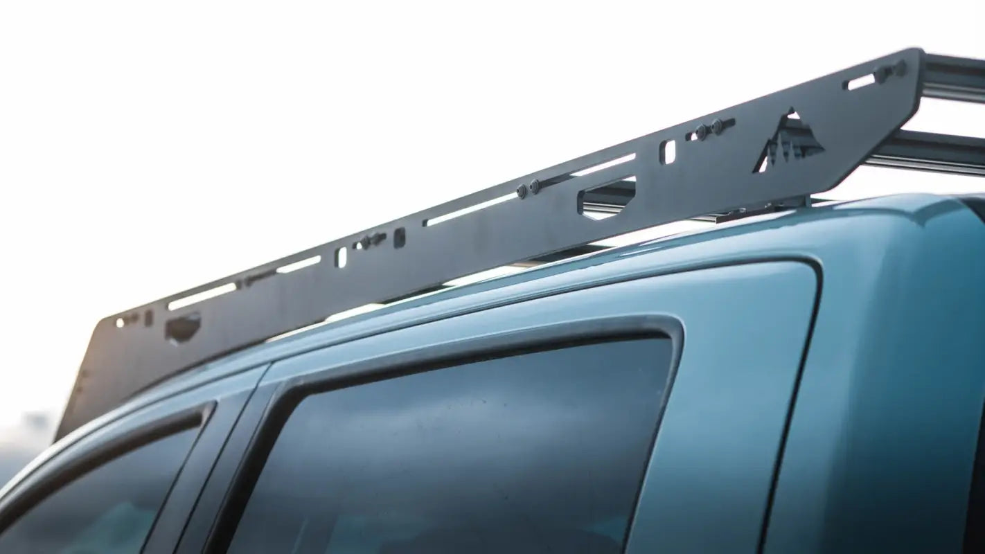 Side view of Big Bear Roof Rack on Toyota Tundra, featuring sleek aluminum design and secure crossbar system for cargo storage.