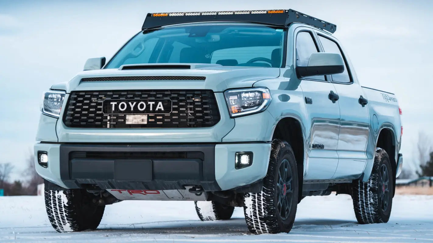 Front view of Toyota Tundra CrewMax with Big Bear Roof Rack, emphasizing rugged aluminum design and compatibility with light bars.