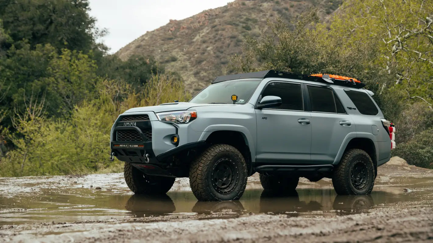 Gray Toyota 4Runner off-roading with The Crestone full-length aluminum roof rack