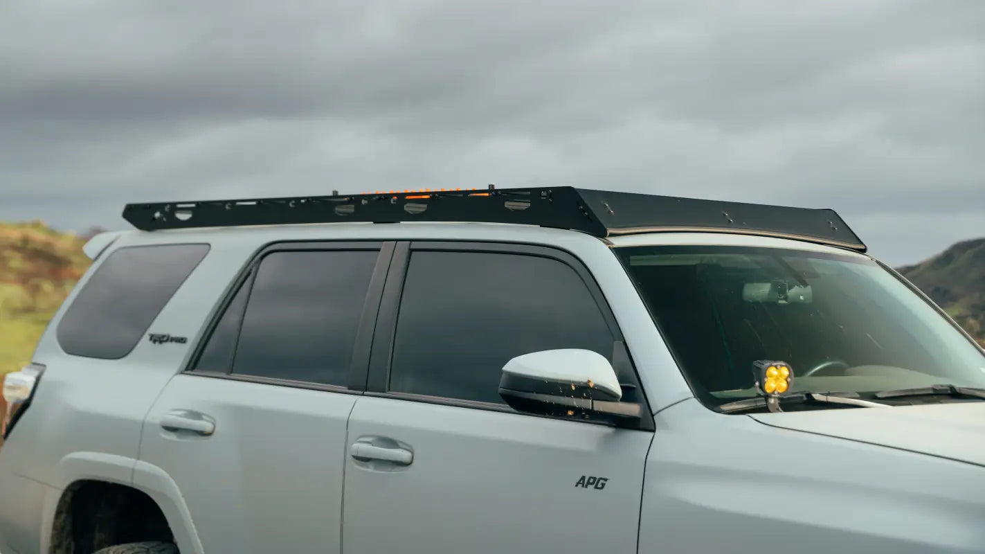 White SUV with full-length aluminum roof rack for 10-24 4Runner model