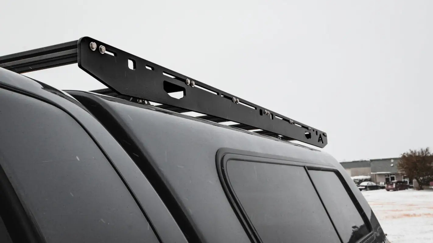 Close-up of the Crow’s Nest aluminum roof rack on a truck, highlighting its sturdy construction and sleek design.
