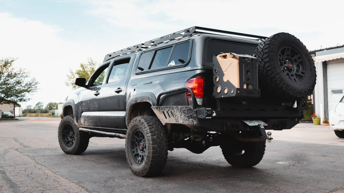 Lifted gray truck with the Crow’s Nest topper rack and additional accessories, showcasing its rugged design for off-road adventures.