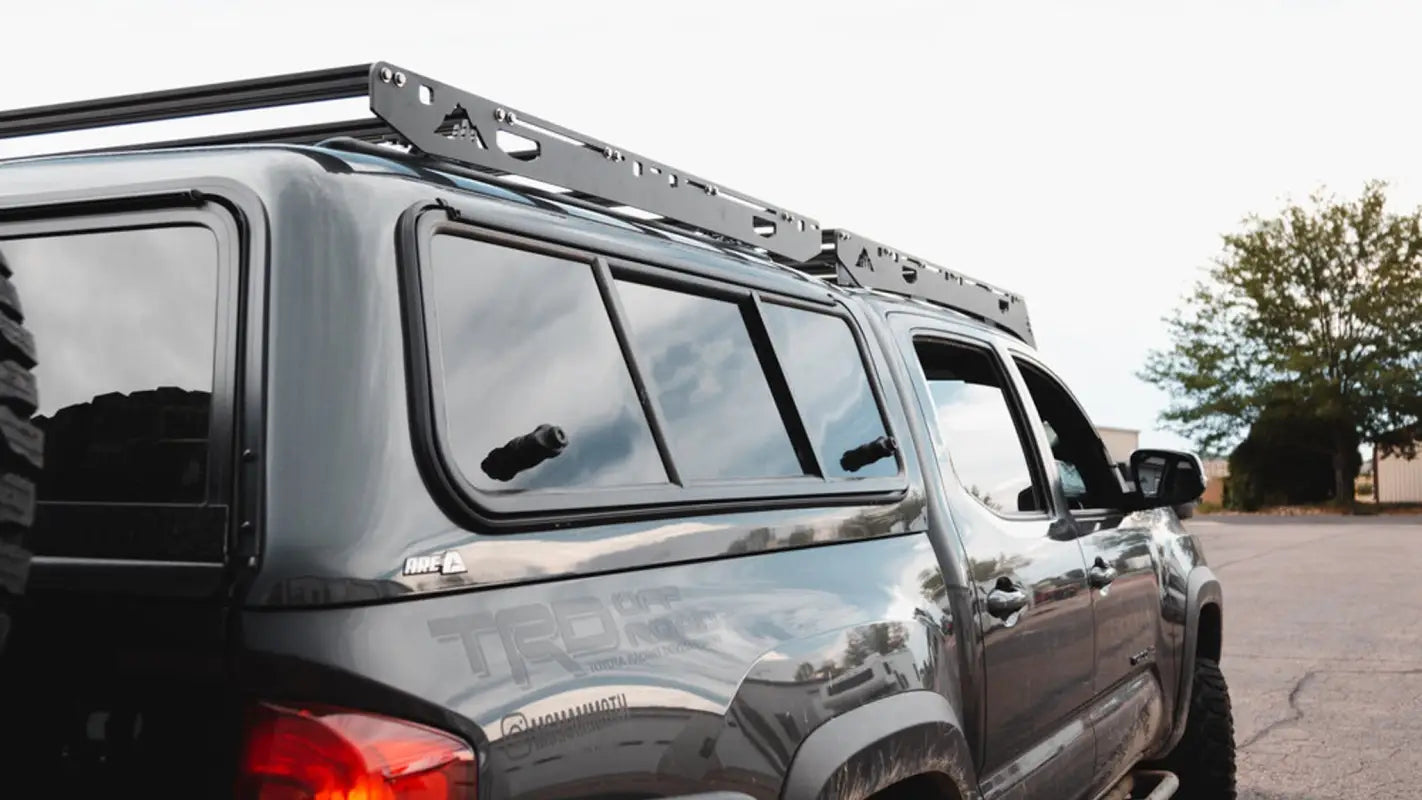 Side view of a gray truck with the Crow’s Nest roof rack, featuring a streamlined design for secure and efficient cargo storage.