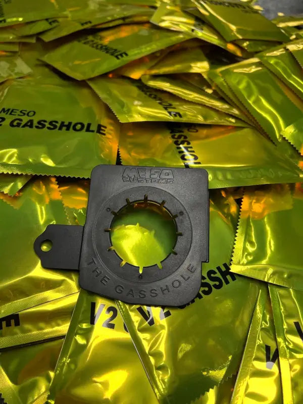 The Gasshole - Tacoma 16-23 insert displayed with branded packaging, highlighting its easy installation and premium design.