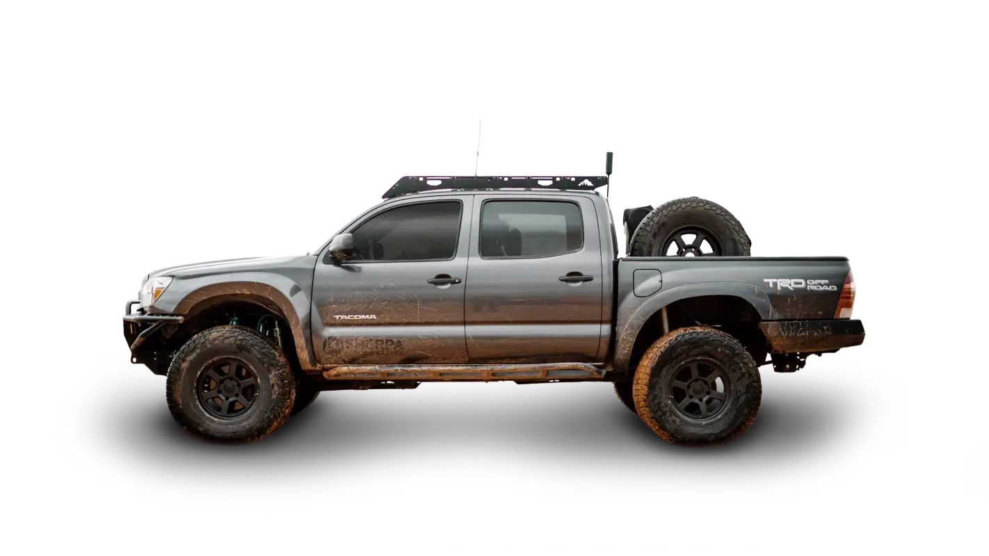 Side view of a Toyota Tacoma Double Cab equipped with the Grand Teton aluminum roof rack, showcasing rugged off-road readiness.