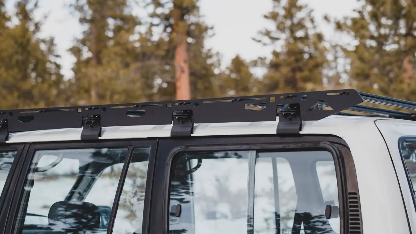Close-up side view of the La Sal roof rack on an 80 Series Land Cruiser, highlighting its precision-engineered design.