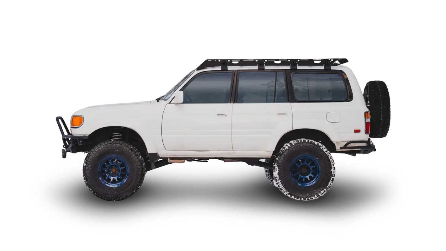 White 80 Series Land Cruiser equipped with the La Sal roof rack, featuring a full-length aluminum design and rugged off-road setup.