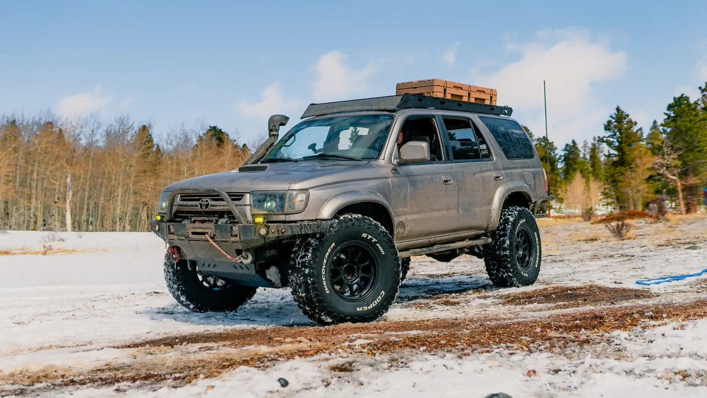 Toyota 4Runner with Matterhorn roof rack and cargo box, parked in a snowy landscape, highlighting off-road capabilities.