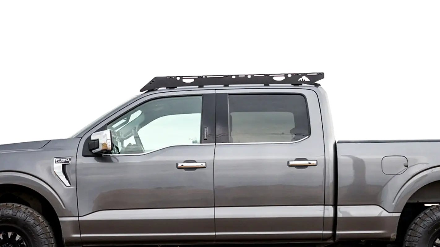 Close-up side view of a 2021-2024 Ford F150 roof rack, showcasing its durable aluminum construction and sleek design.