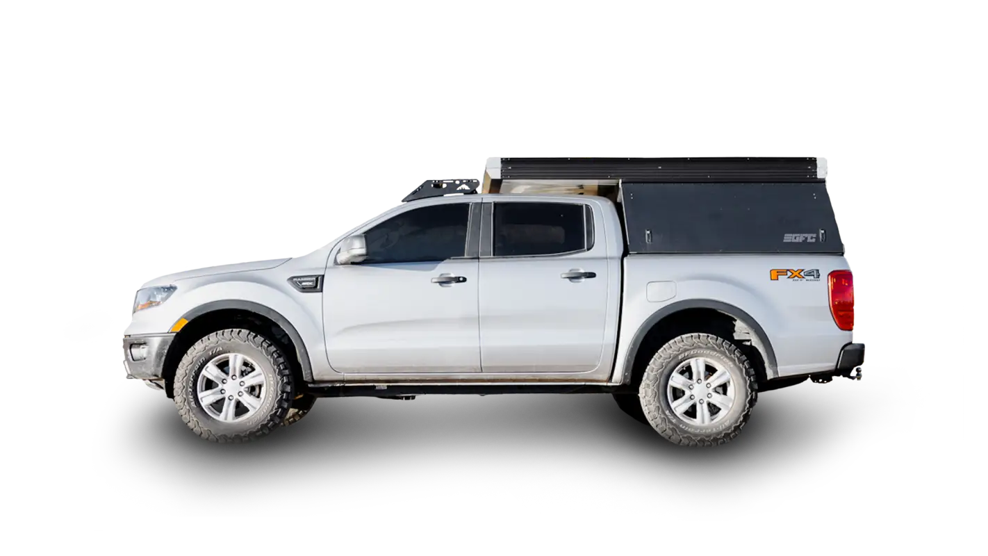 Silver Ford Ranger with Stratus roof rack and GFC camper, showcasing extra storage capacity and rugged design for outdoor adventures.