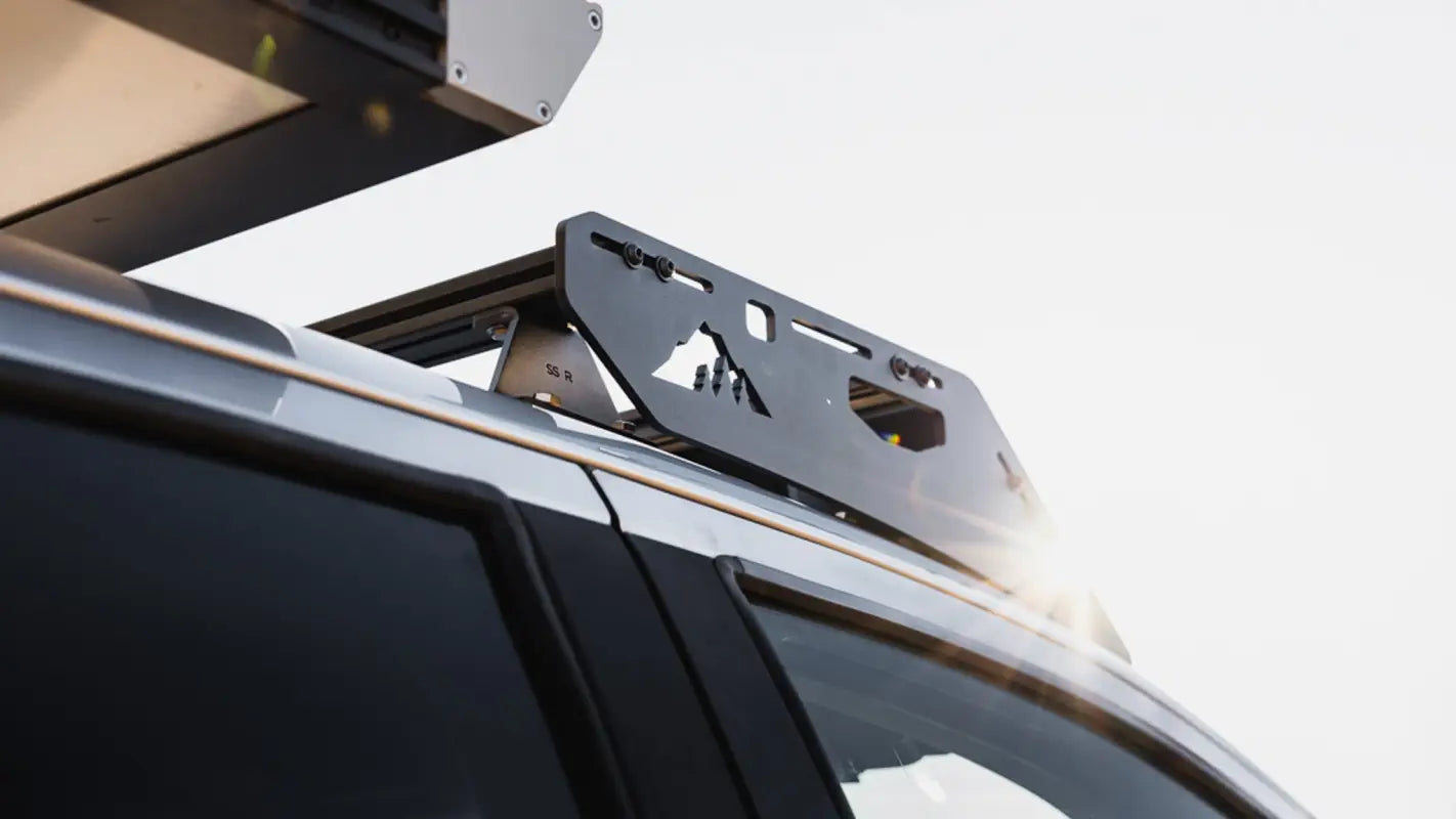 Side view of Stratus roof rack mounted on a Ford Ranger, showcasing its sleek design and compatibility with solar panels and accessories.