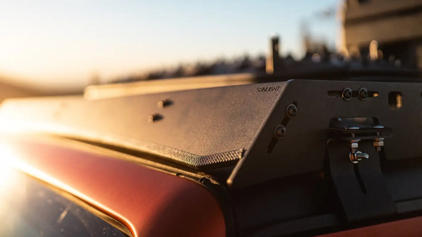 Detailed view of The Sunlight roof rack's aluminum side plate on Jeep Gladiator JT, emphasizing its durable and sleek construction.