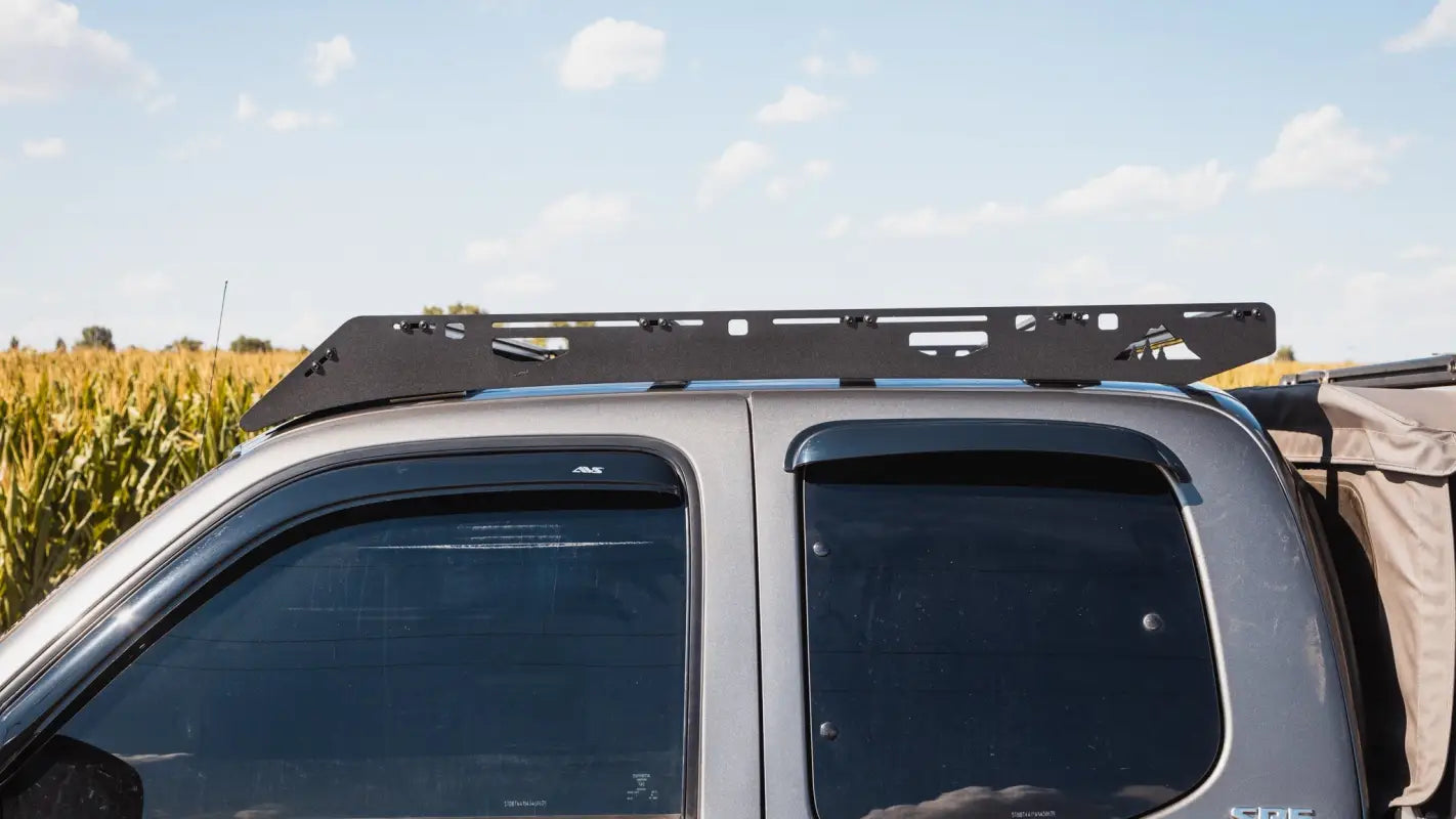 Side profile of Ursa Minor roof rack on Toyota Tundra, designed for durability and secure cargo transport on outdoor trips.