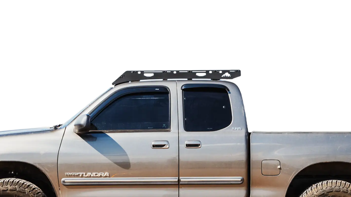 Close-up side view of Ursa Minor roof rack on 2000-2006 Toyota Tundra Access Cab, showcasing durable aluminum construction.