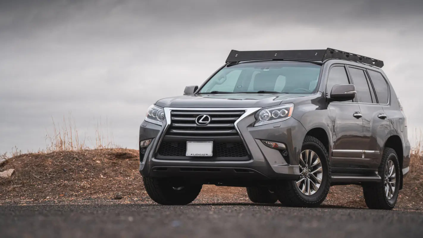 Gray Lexus GX460 SUV with roof rack featuring stainless steel hardware