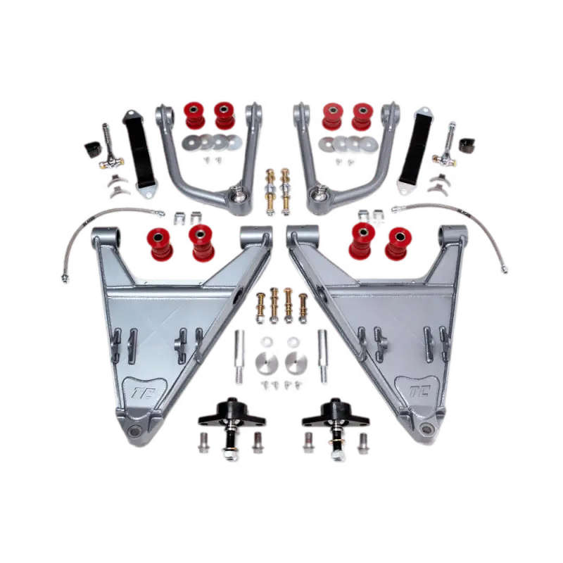 Total Chaos Long Travel Kit for Tacoma (16-23) featuring chromoly control arms, uniballs, urethane bushings, and stainless steel components for 3.5-inch track width.