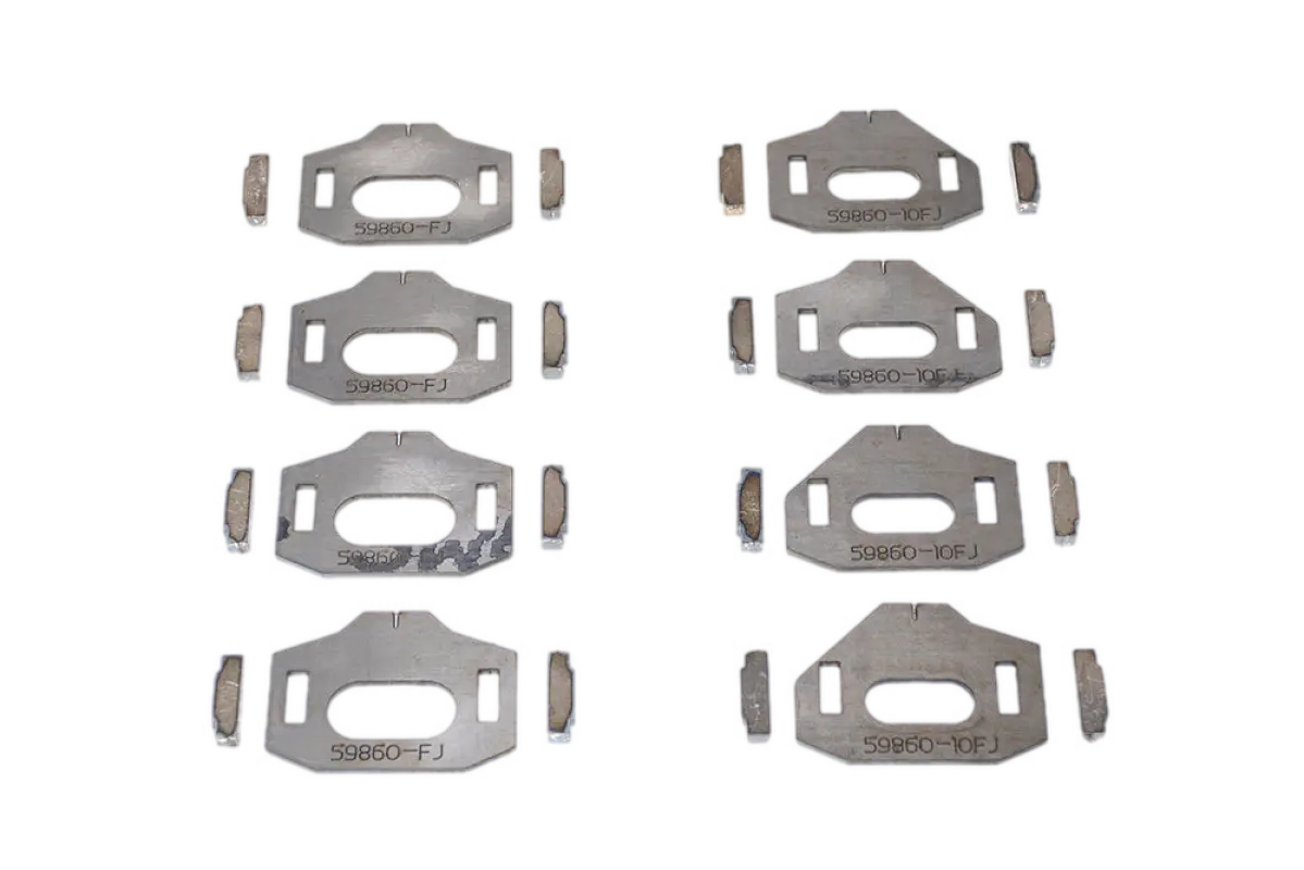 Total Chaos lower control arm cam tab gussets for Tacoma and 4Runner, CNC laser cut plates for suspension reinforcement.