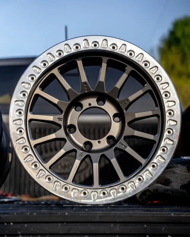 Polished aluminum True Beadlock Ring for Hybrid Wheels V2 installed on a wheel, emphasizing off-road durability and style.