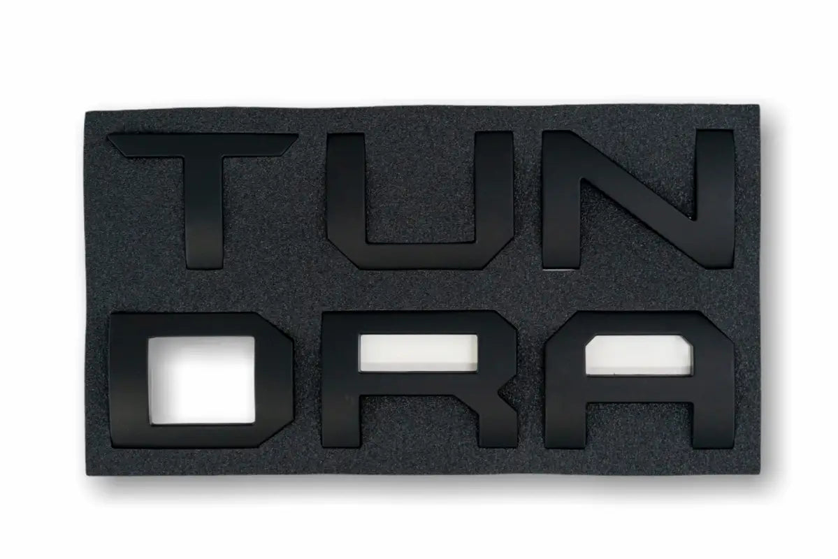 Black TUNDRA overlays and inserts for tailgate with foam packaging in Tundra Overlays & Inserts