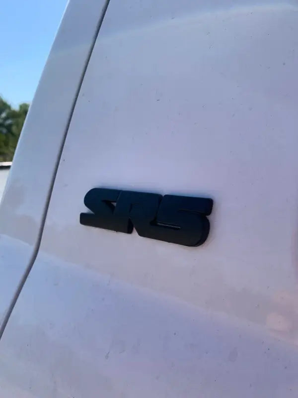 Black SRS emblem on Tundra Overlays & Inserts showcasing Tundra overlays and Tundra tailgate insert