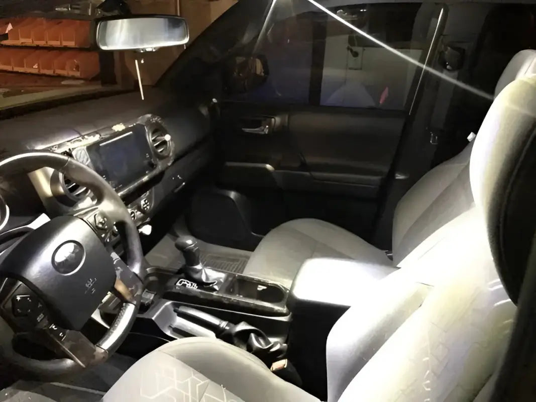 Bright white LED Ultimate Map Lights illuminating the interior of a 16-23 Tacoma, enhancing visibility and style.