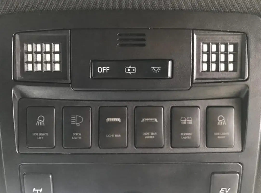 Ultimate Map Lights installed in a 16-23 Tacoma dashboard, showcasing the LED panels integrated into the control panel.