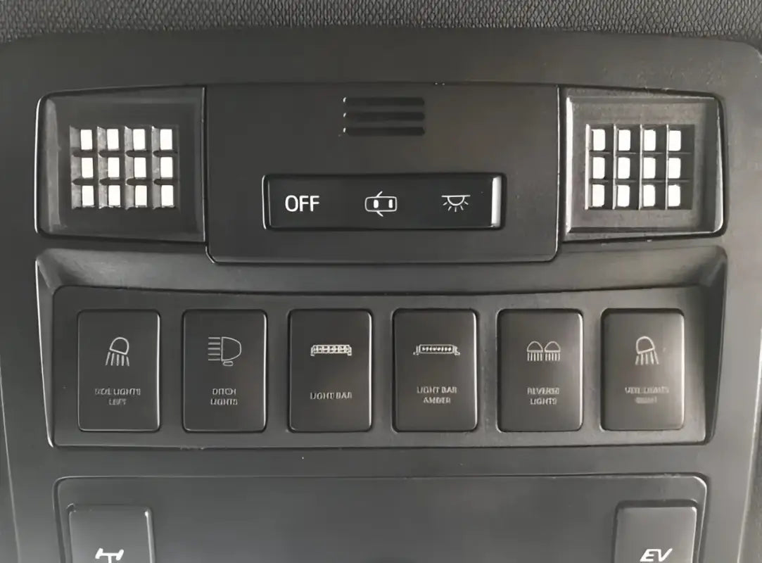 Ultimate Map Lights installed in a 16-23 Tacoma dashboard, showcasing the LED panels integrated into the control panel.