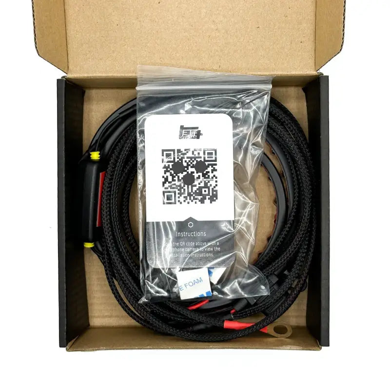 Under hood LED light kit packaged in a box with braided harness, adhesive mounts, and installation instructions included.