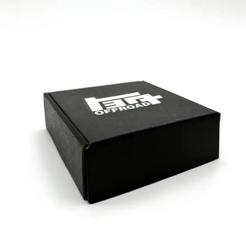 Compact black packaging box for the TEQ Offroad under hood LED light kit, featuring a sleek and durable design.