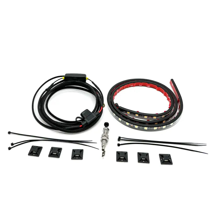 Under hood LED light kit components including a 40-inch LED strip, braided harness, adhesive mounts, and installation accessories.