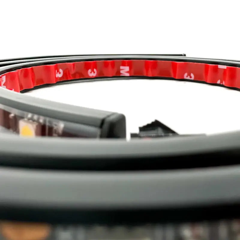 Close-up of the 3M adhesive backing on the under hood LED light strip, ensuring secure and durable installation.