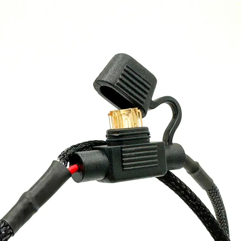 Close-up of the waterproof connector from the under hood LED light kit, designed for secure and reliable connections.
