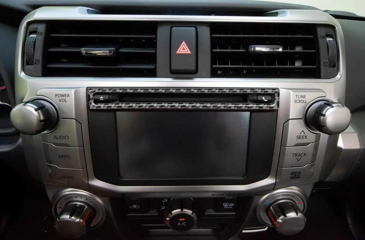 Close-up of upper radio display accent trim fitted on a Toyota 4Runner dashboard, compatible with 2014-2024 models.