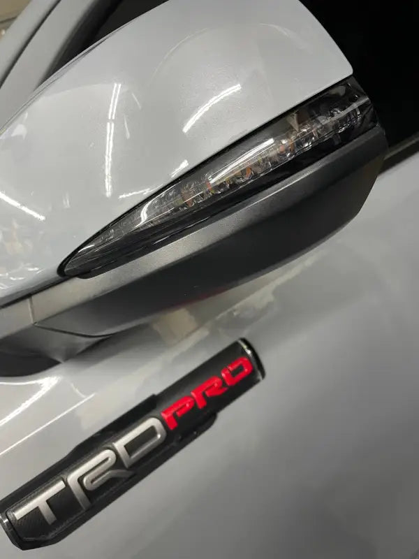 V5 Switchback Signals installed on a Toyota Tacoma TRD Pro side mirror, enhancing style and visibility.