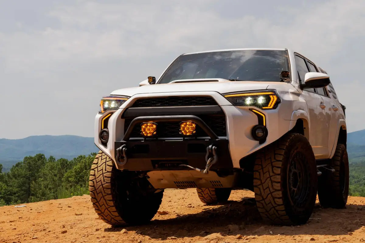 White Toyota 4Runner with XB Evo Headlights for 14-24 featuring high beam and turn signals