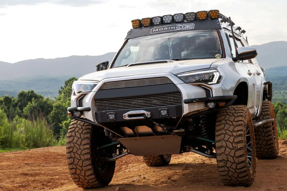 Modified silver 4Runner off-road vehicle with XB Evo Headlights featuring high beam and turn signals