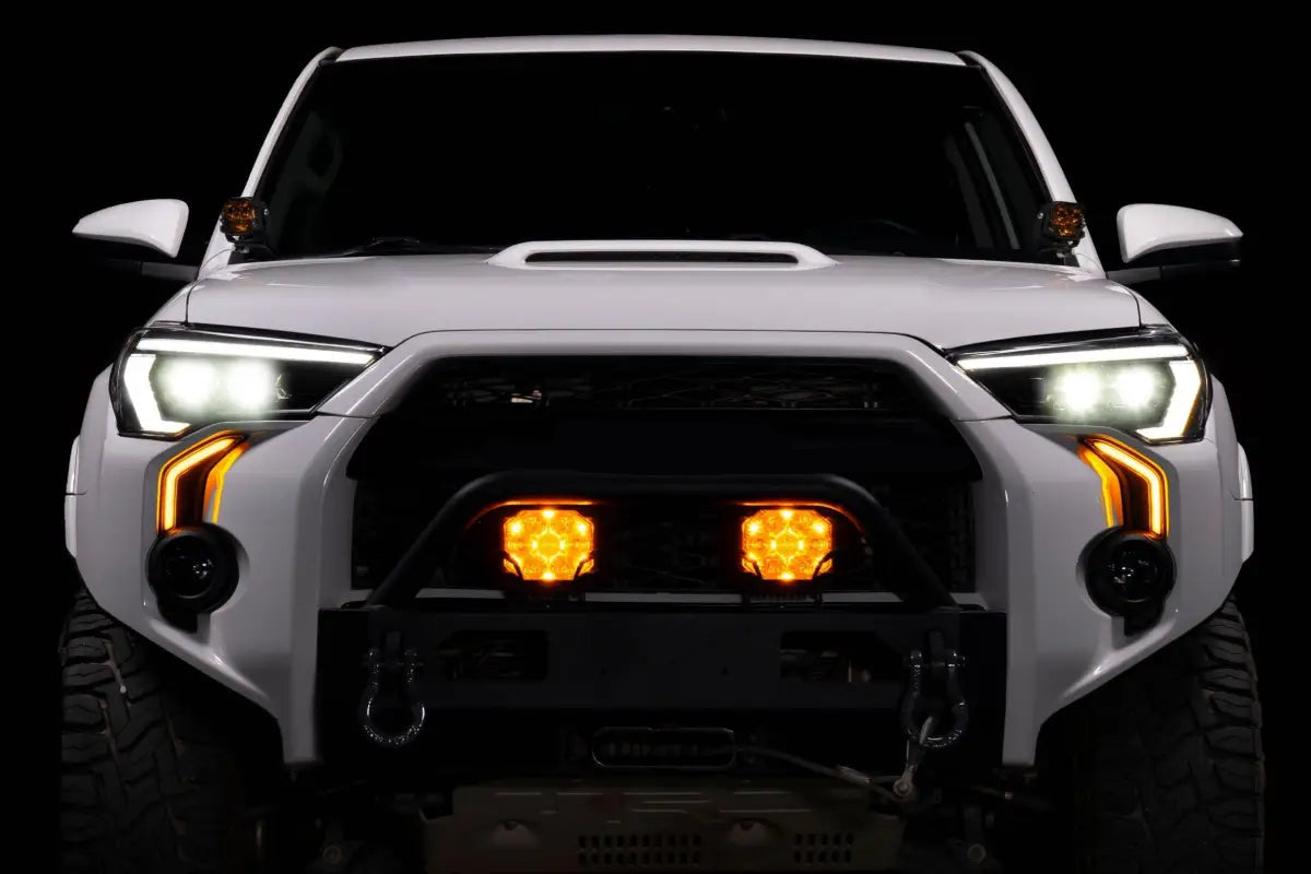 White Toyota 4Runner with aftermarket XB Evo Hybrid Headlights for 14-24 models