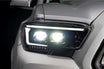 Illuminated XB Evo Hybrid Headlights for 16-23 Tacoma showing bright hybrid headlights