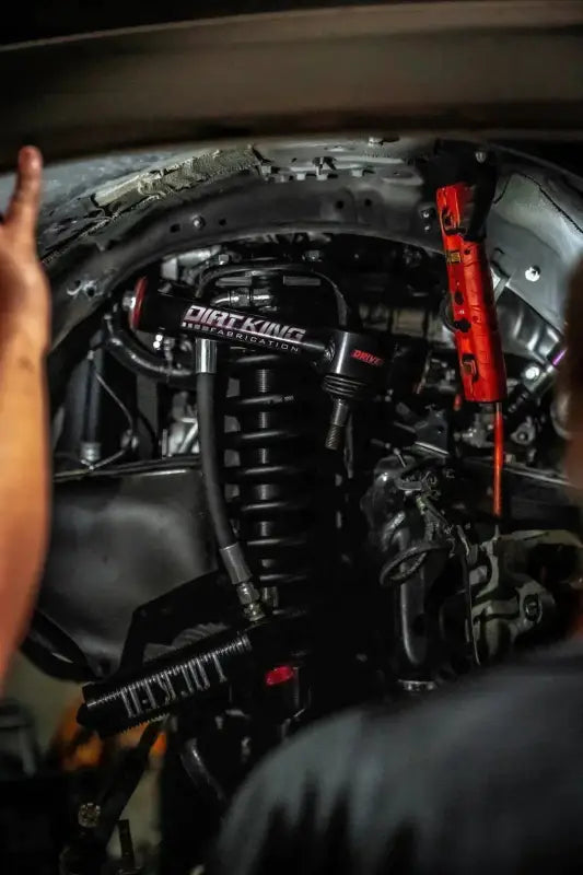 Installed 2010-2014 FJ Cruiser 2.5-inch shock package with Dirt King coilovers, showcasing enhanced suspension in a vehicle.