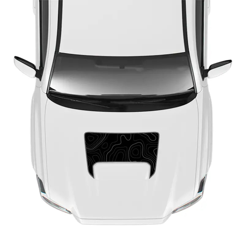 White car with topographic hood decal showcasing the 2016-23 Tacoma Sport Hood Stamp