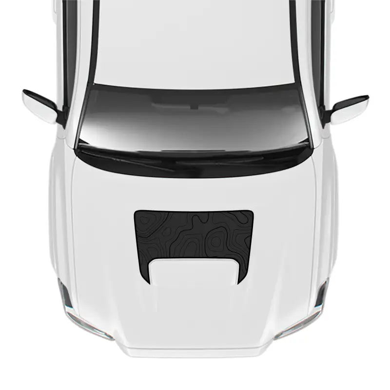 White car hood with topographical design showcasing Tacoma Pro Sport Hood Stamp
