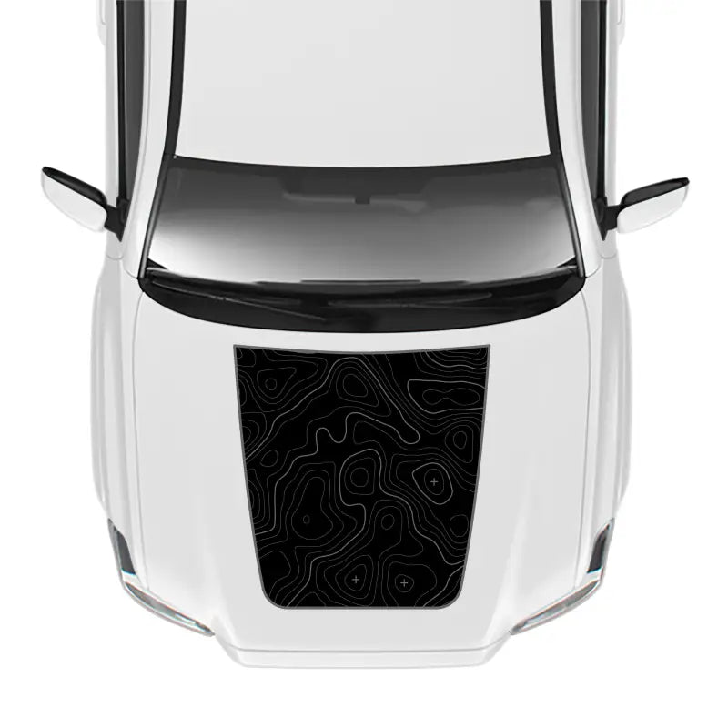 White car with topographic hood decal showcasing the 2016-23 Tacoma Pro Sport Hood Stamp